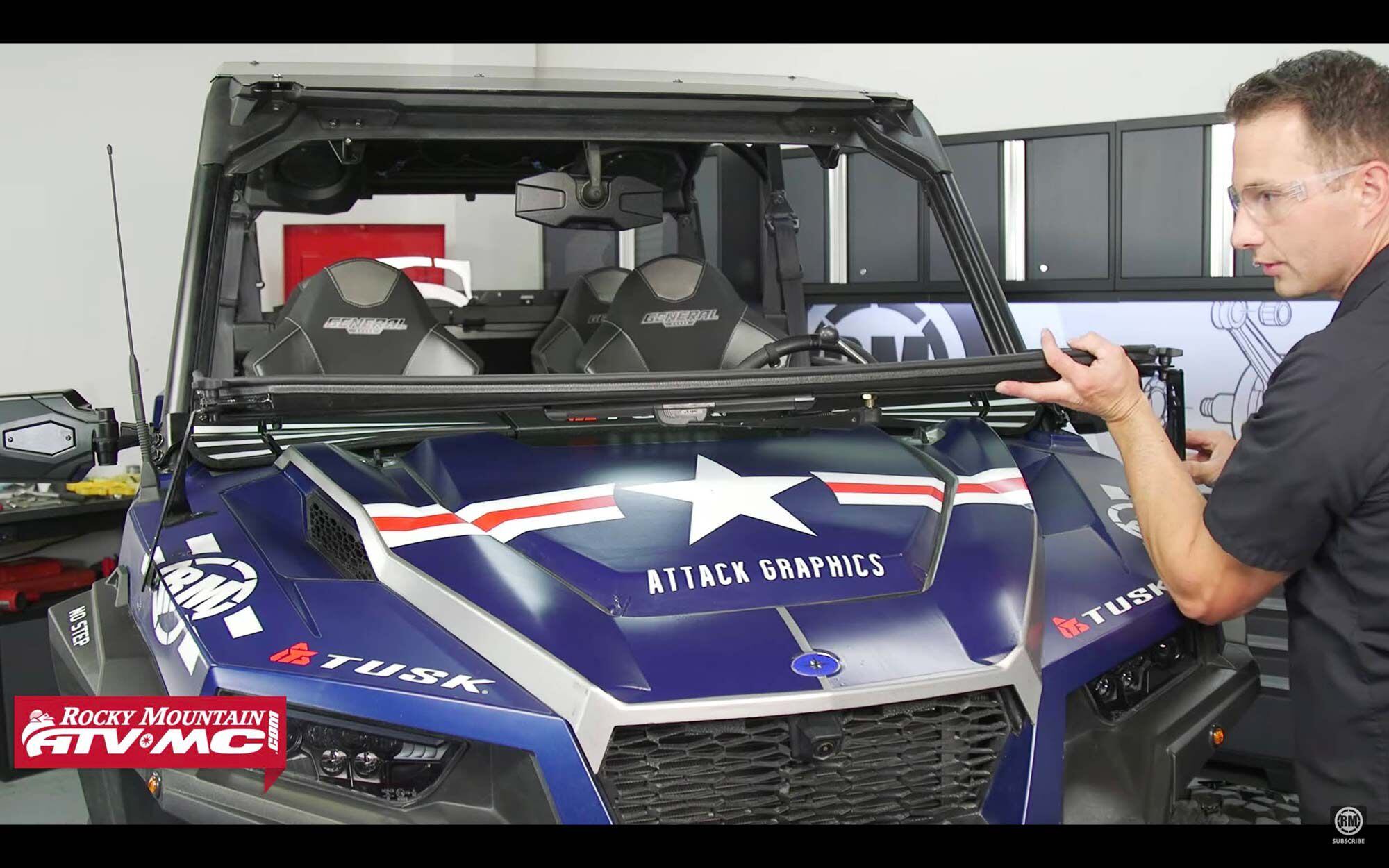 When you want fresh air, the whole assembly folds down and secures to a set of hood-mounted brackets.