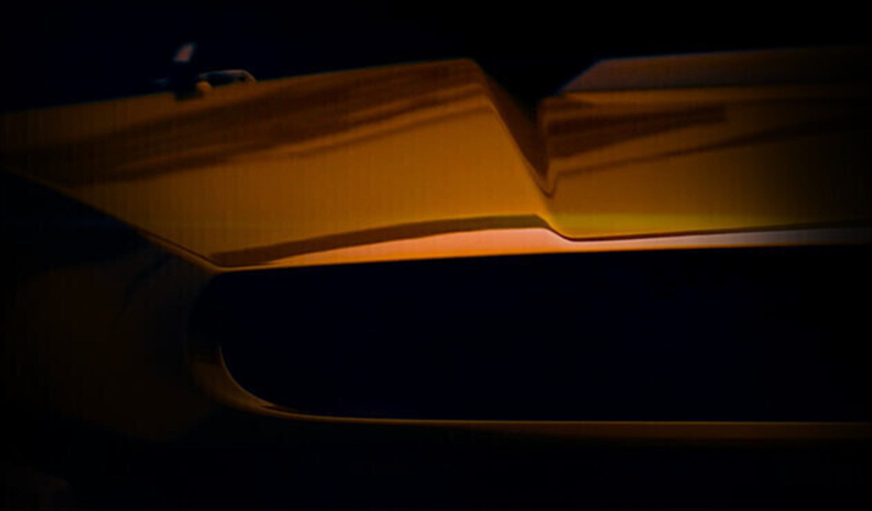 That appears to be a big hood scoop. Functional or not, we like it. We like it a lot.