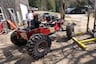 Grind Hard Plumbing Co. mini jeep parked in garage