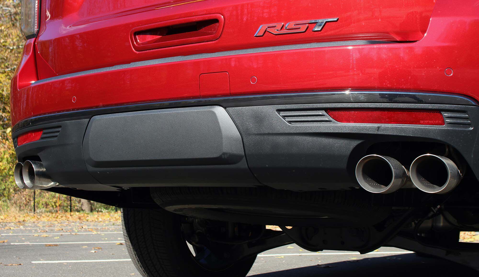 The Tahoe’s tow hitch lives beneath a plastic cover between each set of oversize dual exhaust tips.