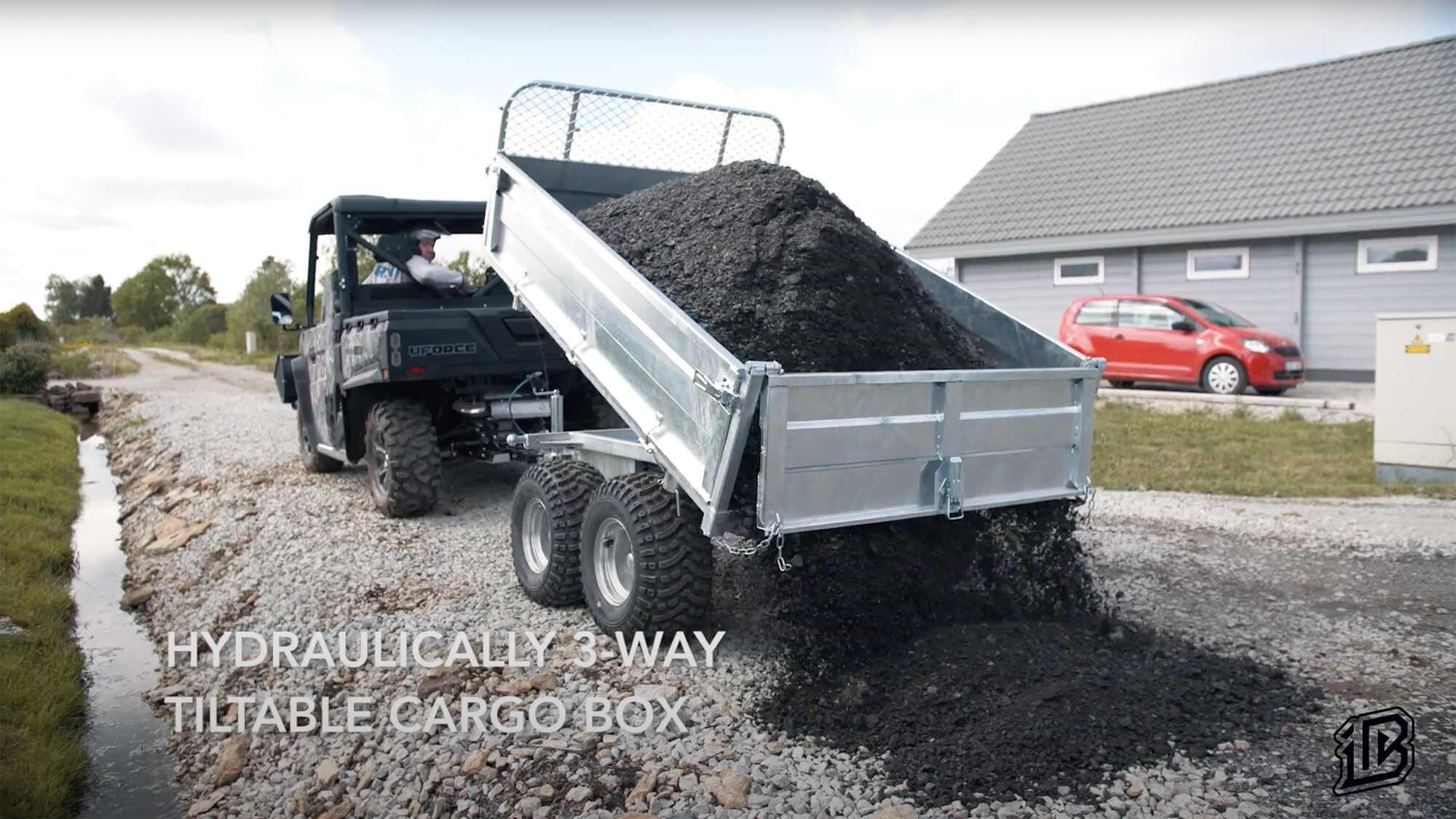 The hydraulic three-way tilt trailer lets workers shuttle materials around property and unload quickly, saving time.